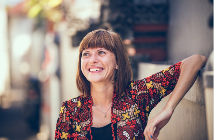 Female Scullion LAW client smiles giving testimonial