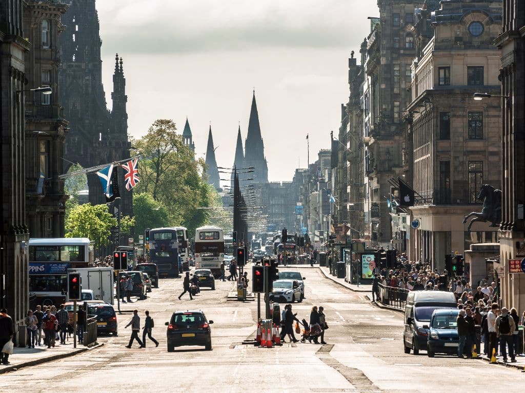 Cars driving in Edinburgh city centre, emphasising the possibility of police drug driving checks at any time. Scullion LAW offers legal assistance with offices in Edinburgh, Glasgow, and Hamilton.